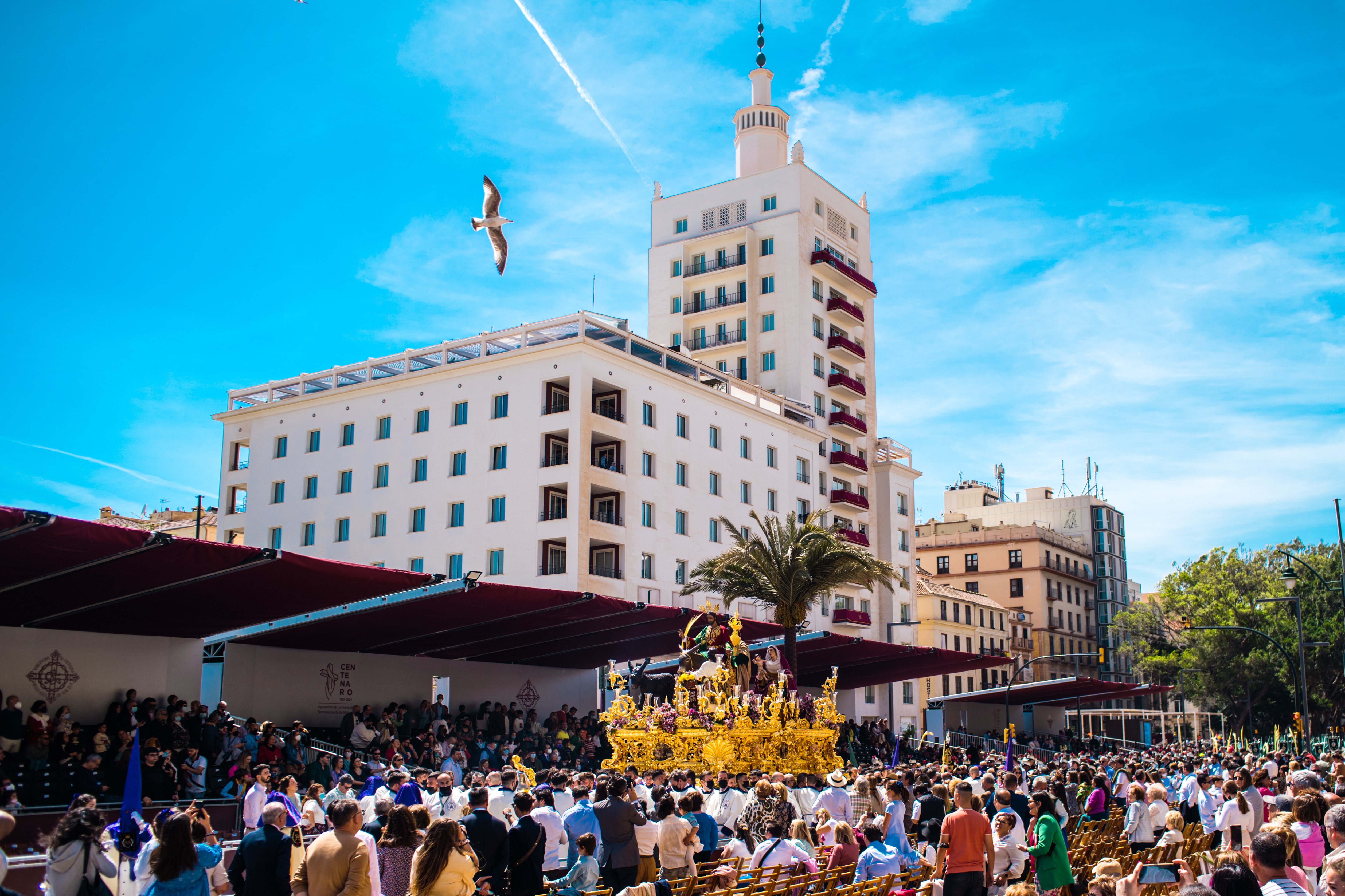 Festival during holy week where men carry floats depicting Jesus and Mary